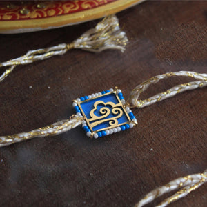 BeAbhika Gold Tone Cloud Theme Wind Rakhi Nature Inspired Rakhi Blue Acrylic Designer Unqiue Famous Rakhi Lightweight Easy To Tie Rakhi Available At Best Price In India Online COD Available Send Rakhi To Brother Small Brother Big Brother Younger Brother Send Rakhi Abroad With Roli Chawal Capsules