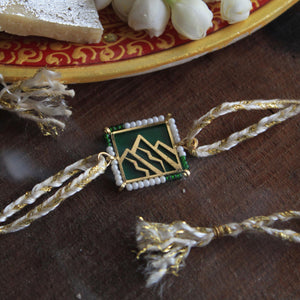 BeAbhika Gold Tone Mountain Lover Forest Rakhi Nature Inspired Rakhi Blue Acrylic Designer Unqiue Famous Rakhi Lightweight Easy To Tie Rakhi Available At Best Price In India Online COD Available Send Rakhi To Brother Small Brother Big Brother Younger Brother Send Rakhi Abroad With Roli Chawal Capsules