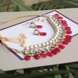 Kundan choker set in gold-tone with matching earrings and long bridal necklace, perfect for wedding functions , festive and bridal wear