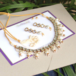 Kundan choker set in gold-tone with matching earrings and long bridal necklace, perfect for wedding functions , festive and bridal wear