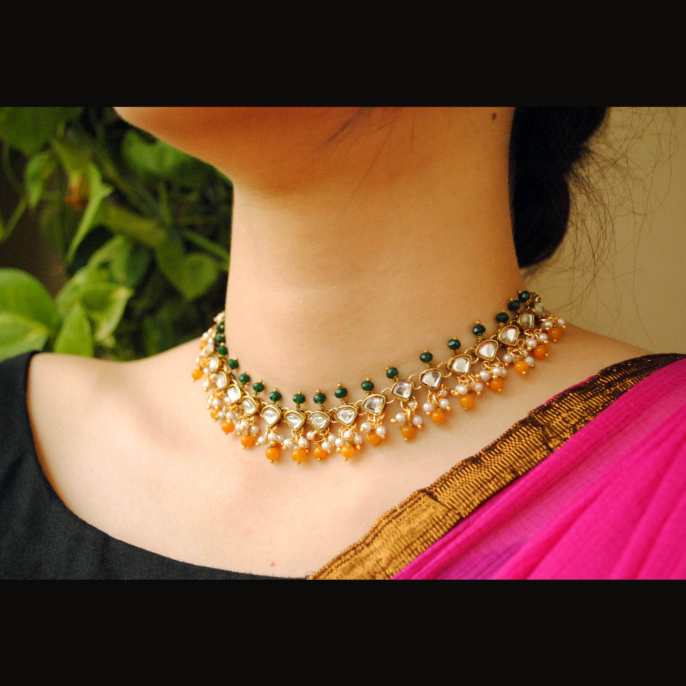 Kundan choker set in gold-tone with matching earrings and long bridal necklace, perfect for wedding functions , festive and bridal wear