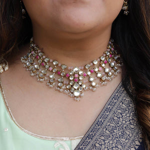 Kundan choker set in gold-tone with matching earrings and long bridal necklace, perfect for wedding functions , festive and bridal wear