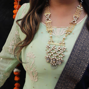 Kundan choker set in gold-tone with matching earrings and long bridal necklace, perfect for wedding functions , festive and bridal wear