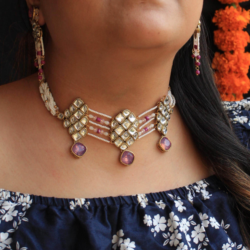 Kundan choker set in gold-tone with matching earrings and long bridal necklace, perfect for wedding functions , festive and bridal wear