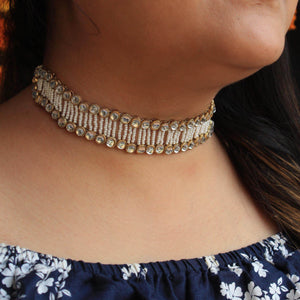 Kundan choker set in gold-tone with matching earrings and long bridal necklace, perfect for wedding functions , festive and bridal wear