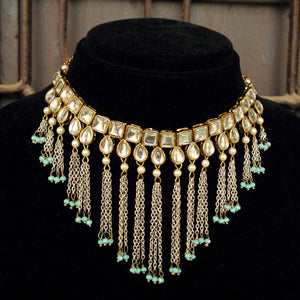 Kundan choker set in gold-tone with matching earrings and long bridal necklace, perfect for wedding functions , festive and bridal wear