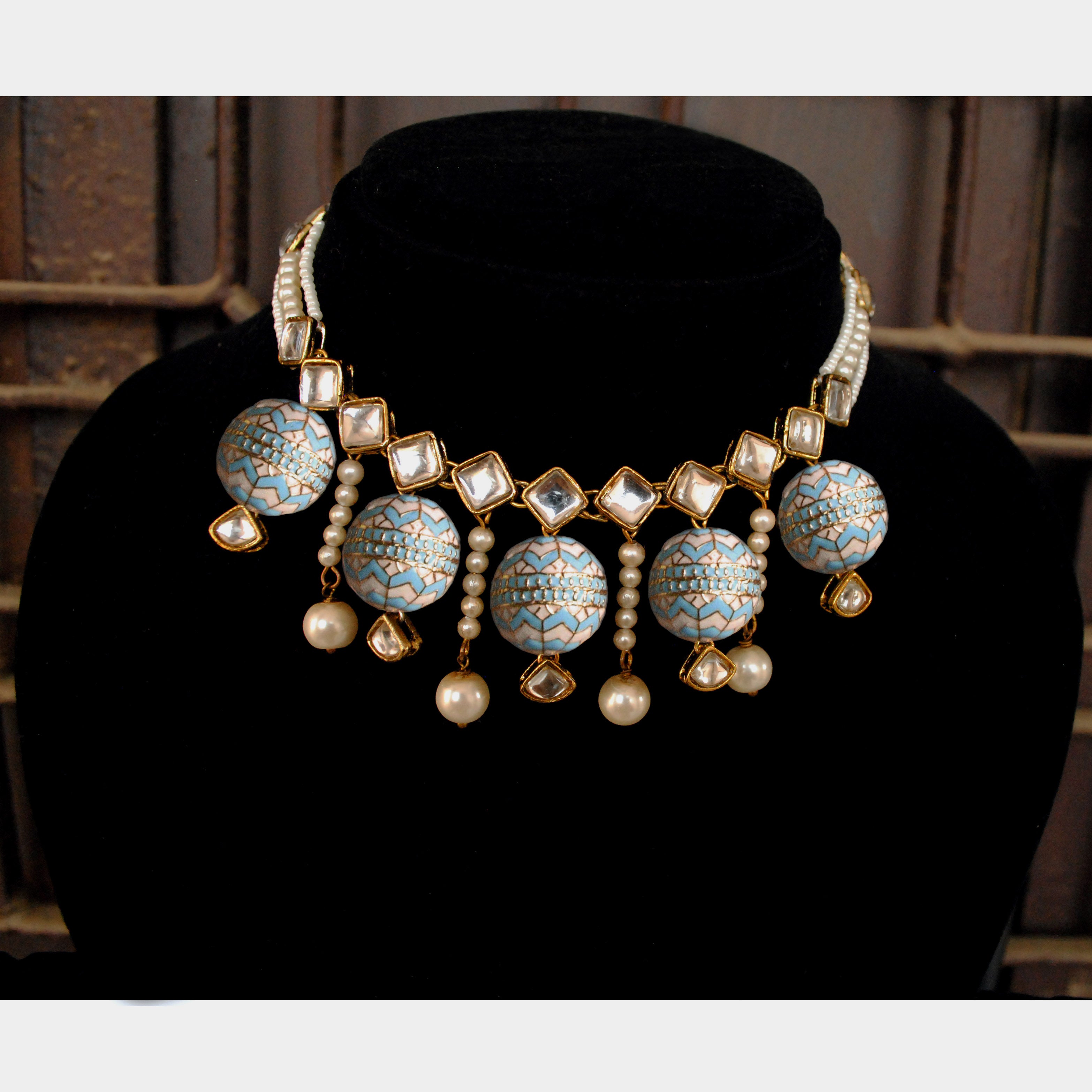 Kundan choker set in gold-tone with matching earrings and long bridal necklace, perfect for wedding functions , festive and bridal wear