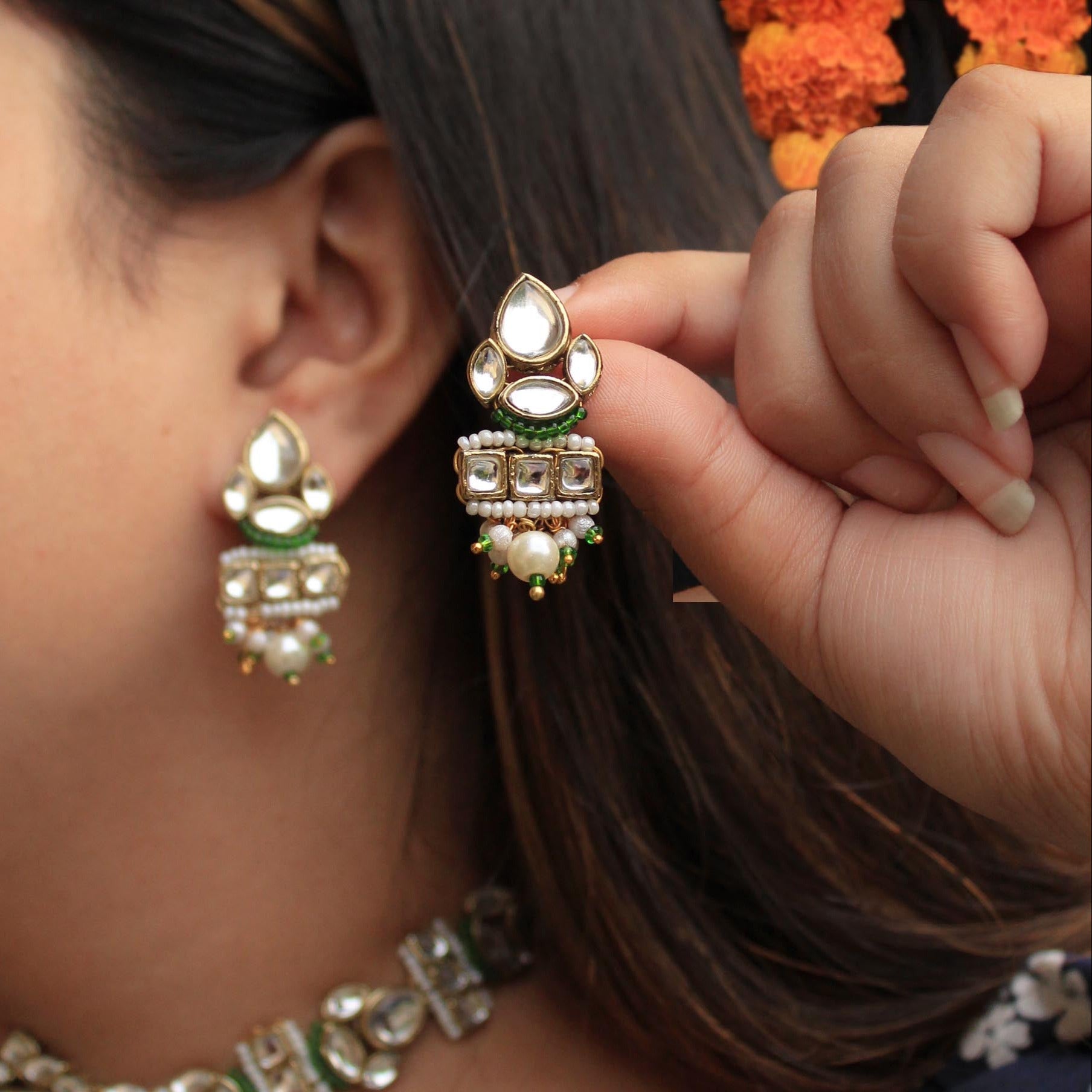 Traditional Kundan earrings in gold-tone, perfect for weddings and festive wear